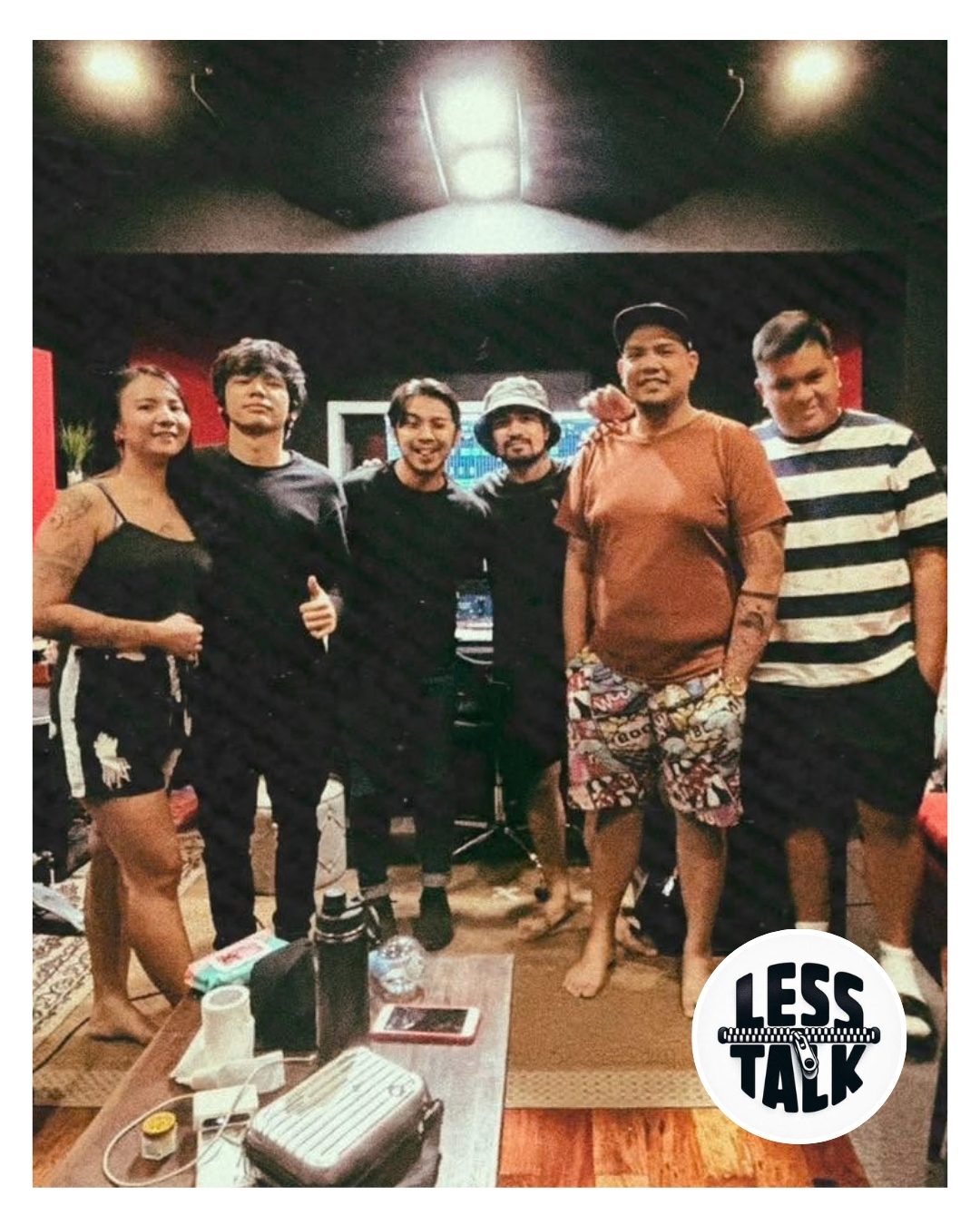 The band Less Talk in a recording studio