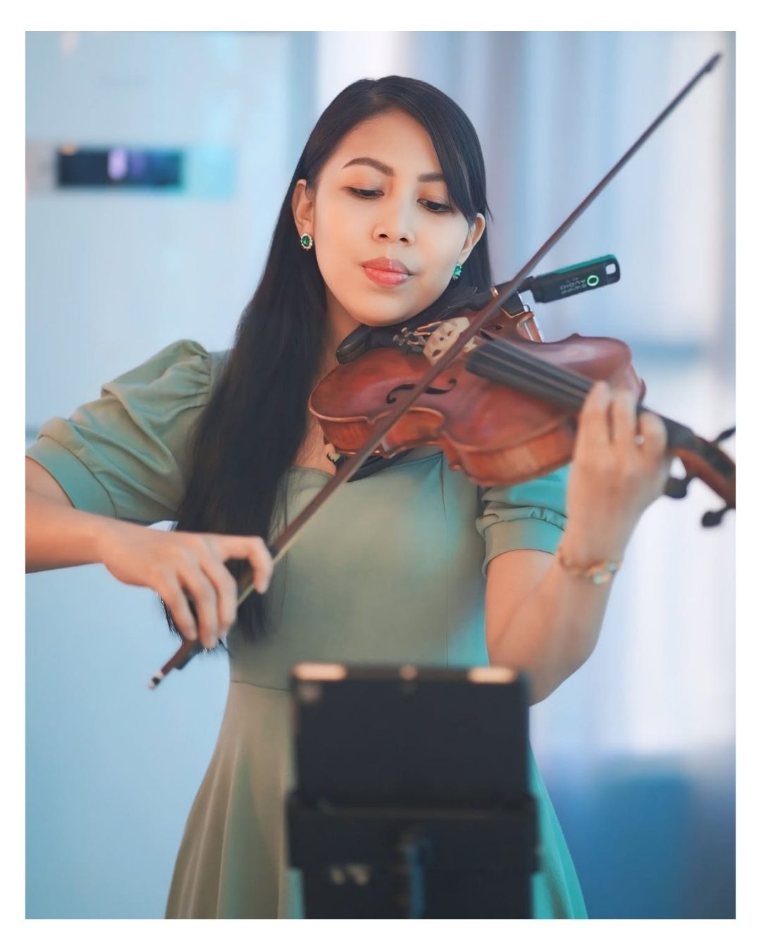 Strings of Serenity performing on violin